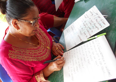 Nepalese woman writing